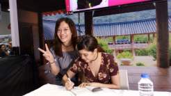 Sue signs my Korea Travel Guide Book from KTO Manila